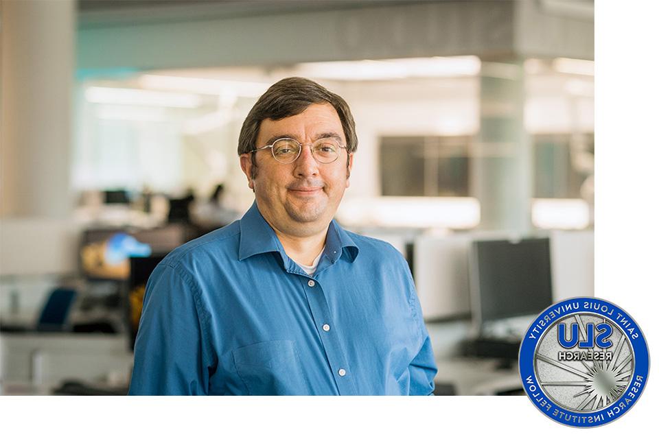 Steven Rogers, Ph.D. standing in a room with computers